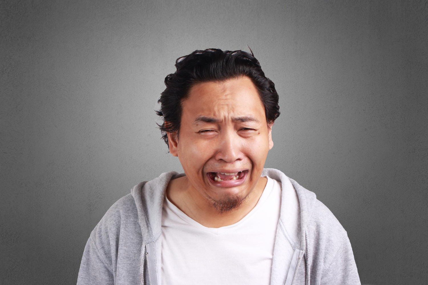 Man looking fearful as he doesn't understand how painless a vasectomy really is